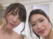Japanese two wet girls serving guy in bubble bath